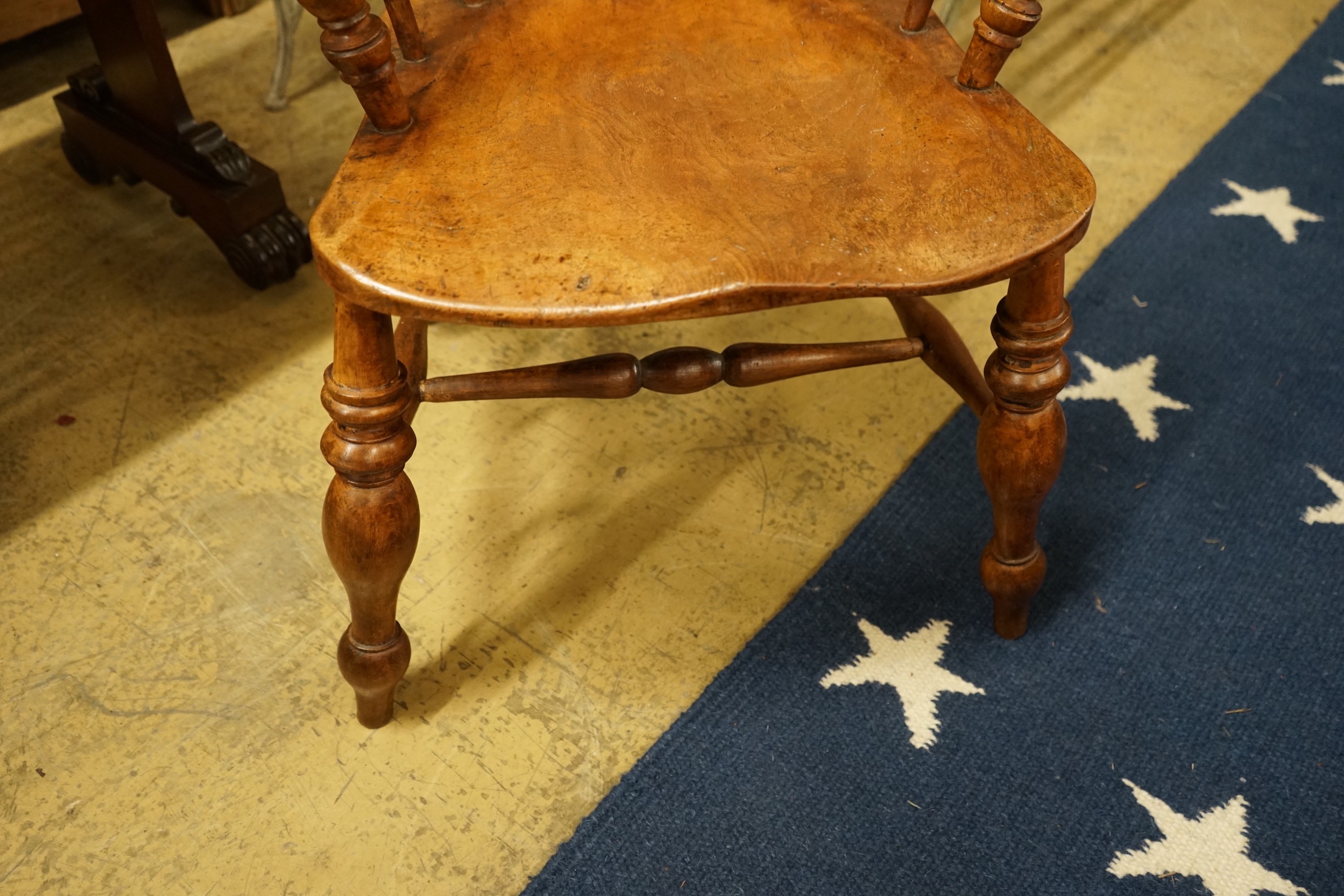 A Victorian elm and beech pierced back bow smoker's chair, width 66cm, depth 45cm, height 80cm